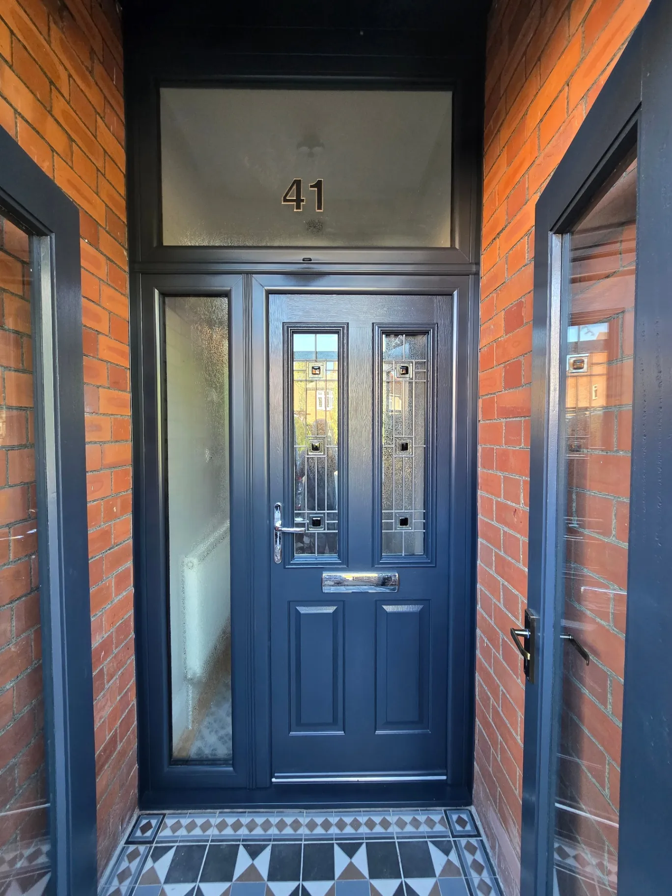 Modern uPVC front door and surrounding frame professionally spray-painted in a matte dark anthracite grey finish