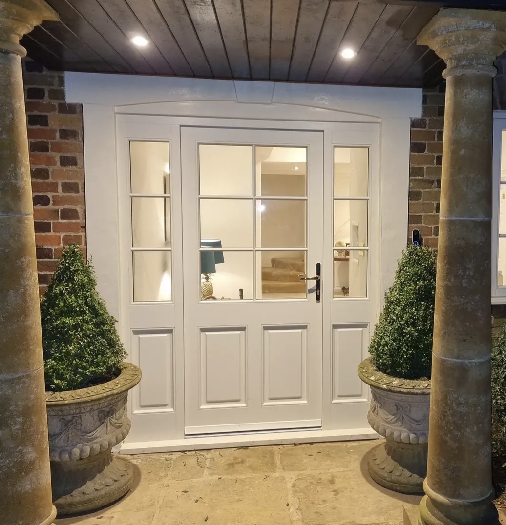 Front door and stone-columned surround hand painted in Guilsborough, Northamptonshire