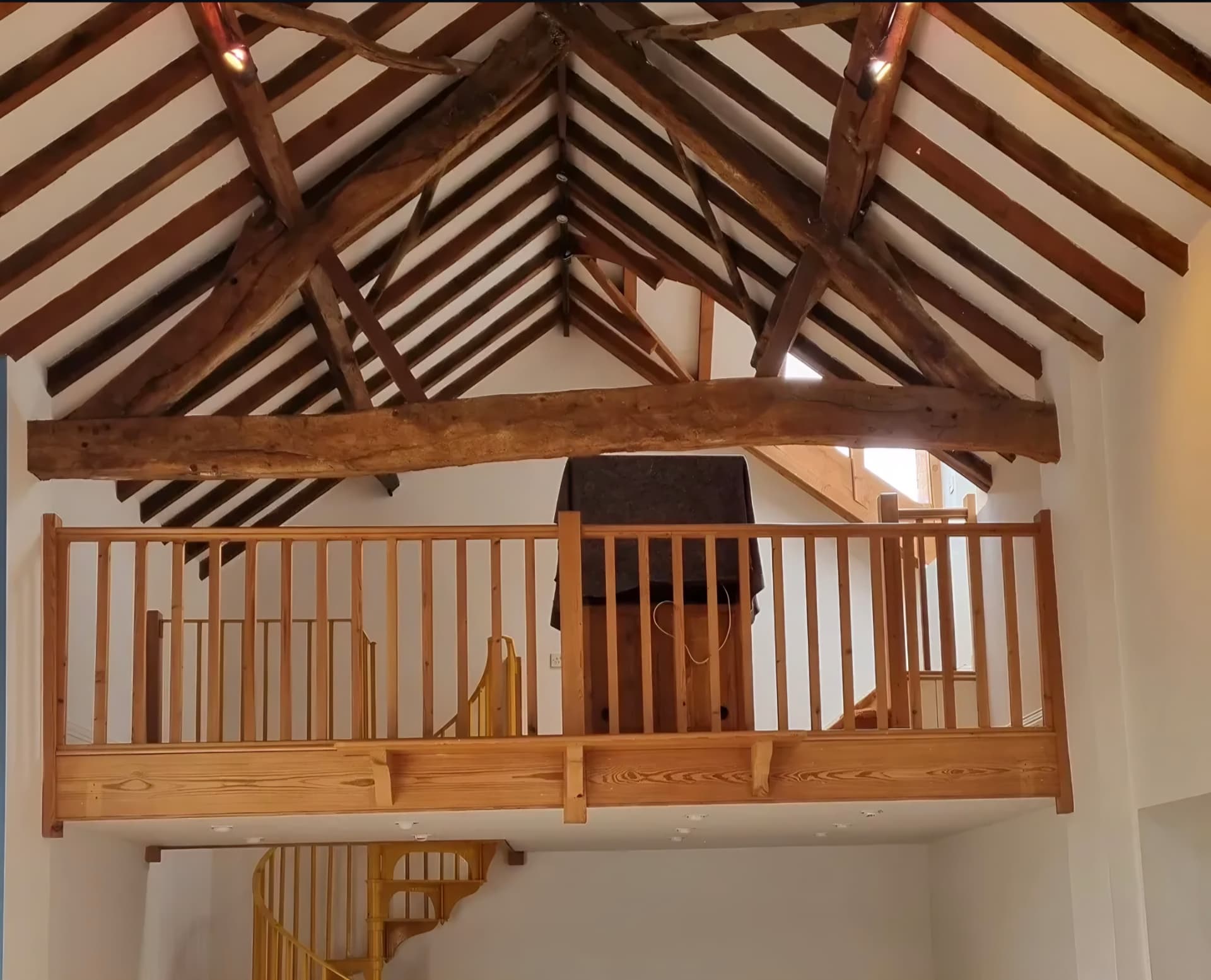 Repainted walls and ceiling beneath a timber roof in Great Bowden, Leicestershire