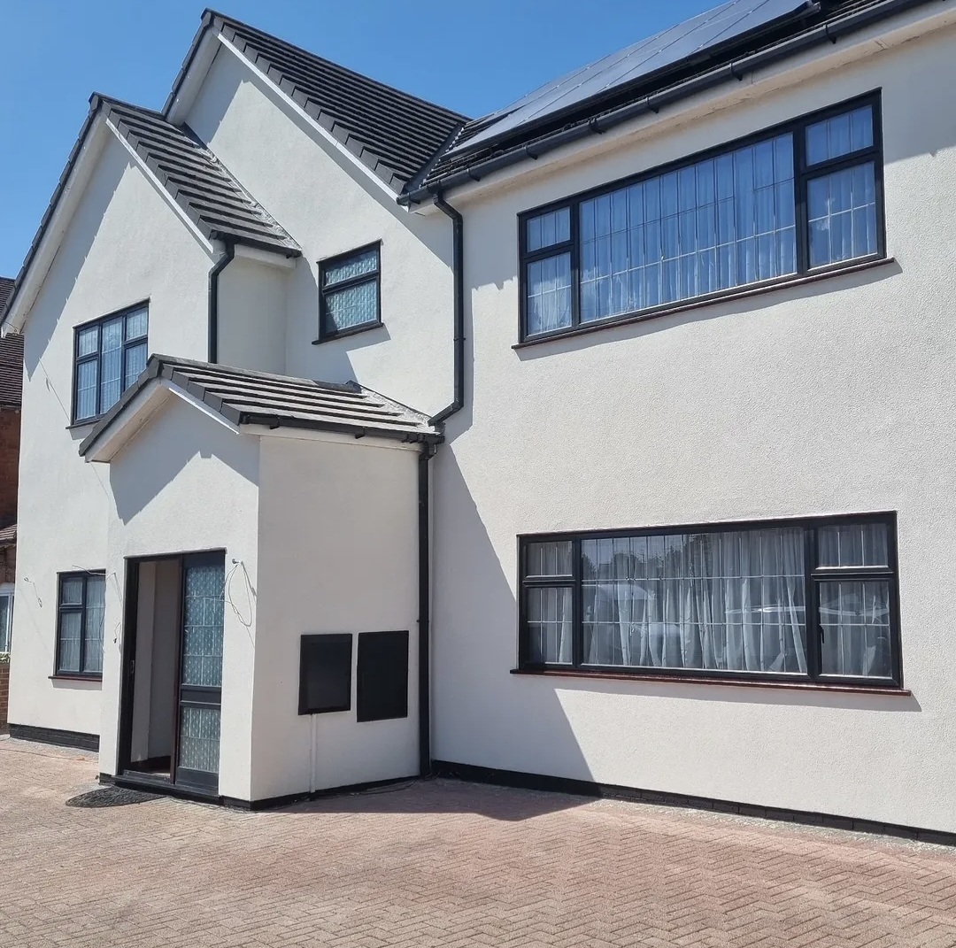 White render masonry repaint with black windows in Leicester