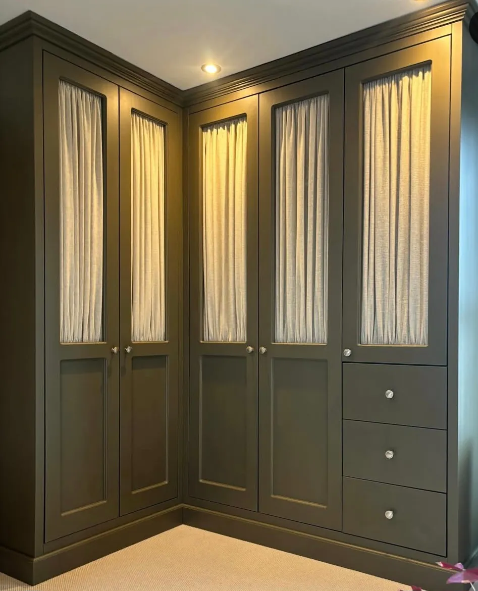 Corner wardrobe sprayed in an olive satin finish