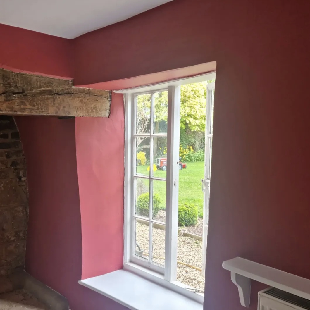 Deep red room fully repainted at the Old Rectory in Welham, Leicestershire