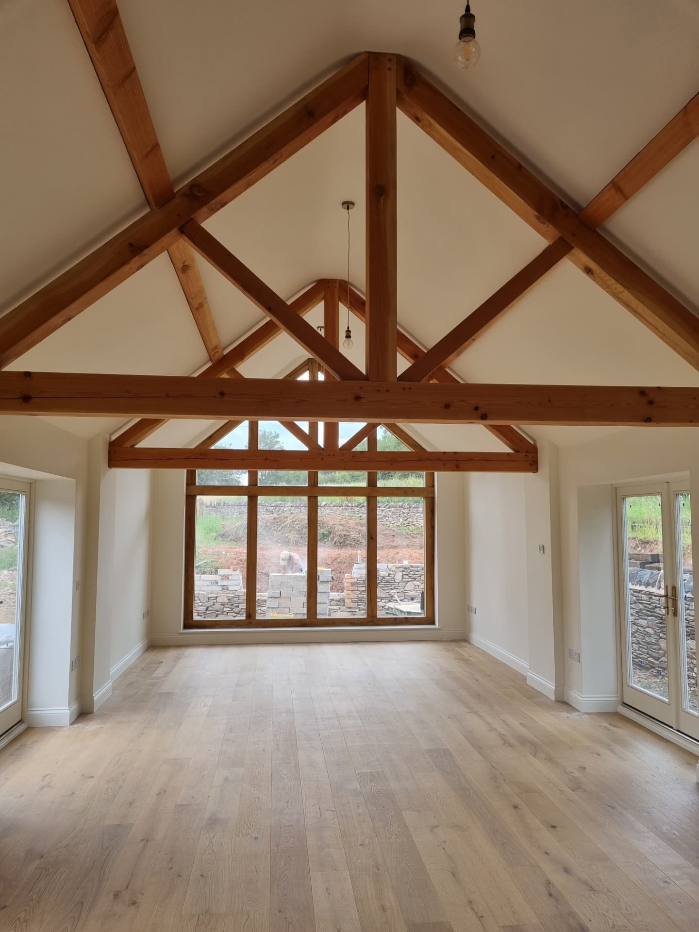 Barn conversion interior with exposed timber trusses decorated in Woodhouse Eaves, Leicestershire